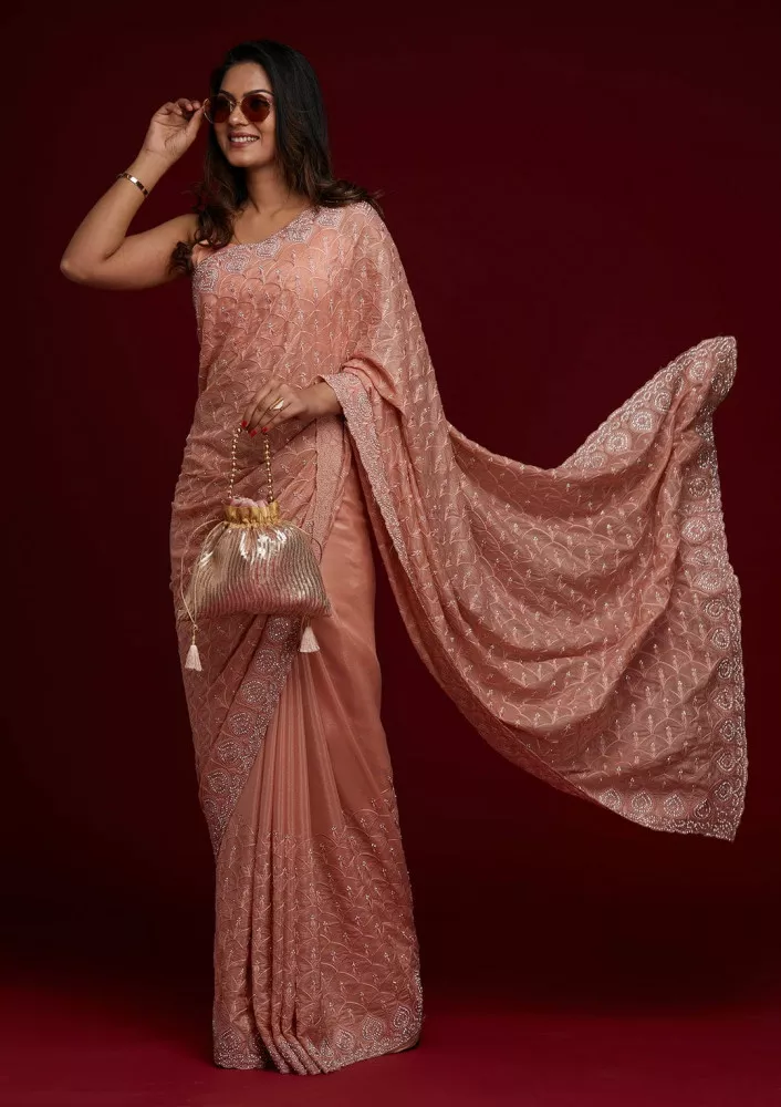 Buy Look Georgeous in lastest embroidery and embalished half and half saree,  its cums with netted border with golden flower print designs, Saree is  embellished with heavy stone diamond work. Saree comes