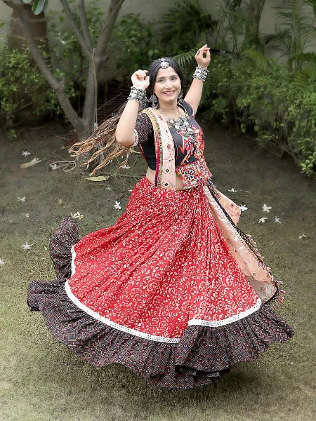 Gujrati Couple performing dandiya dance garba Navratri Festival in-India