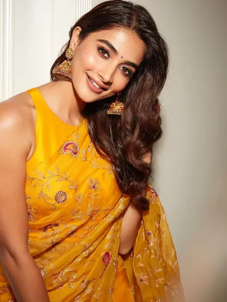 Photo of South Indian bride in a lime green and yellow saree.