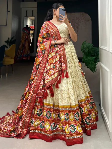 Tussar Silk Lehenga Choli in White Color With Patola Print and Foil Work