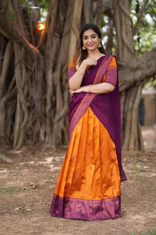 Sreemukhi looks divine in an orange-green half saree for 