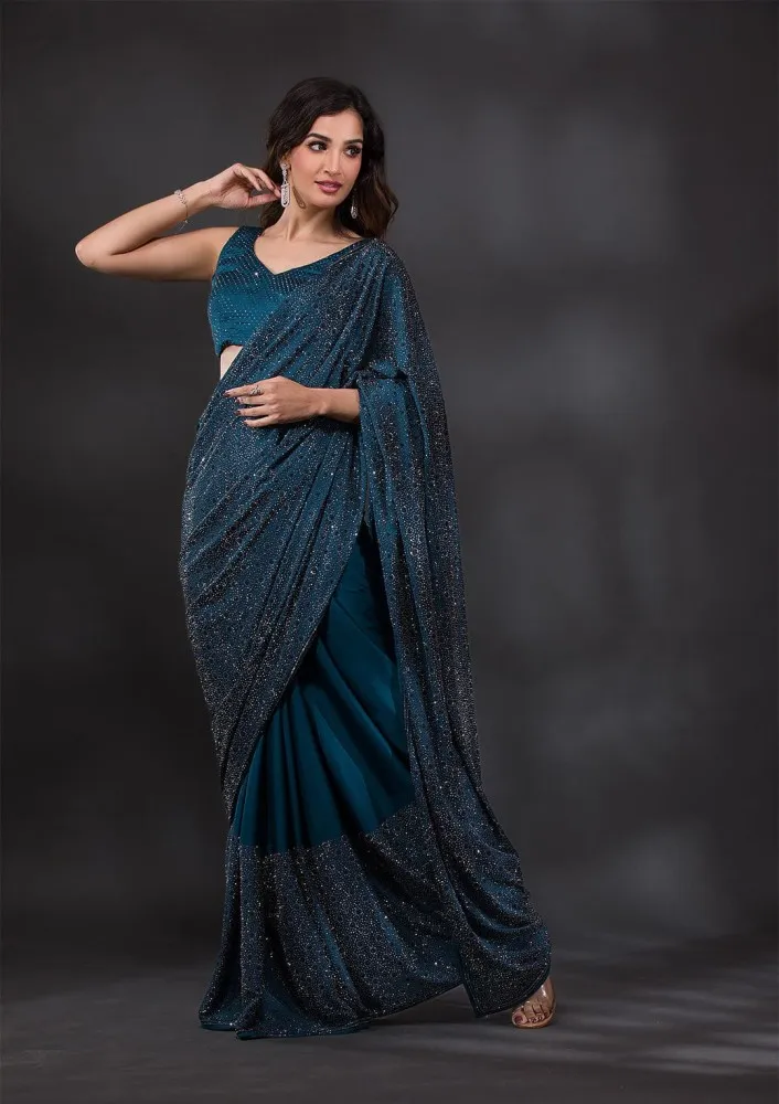 Borderless peacock blue Kancheepuram silk saree with big & small size leaf  designs on its body, pallu with leaves