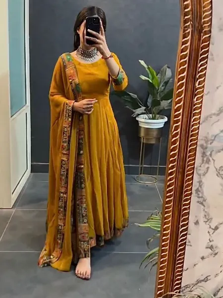 Mustard Color Georgette Party Wear Gown With Printed Lace Border Dupatta